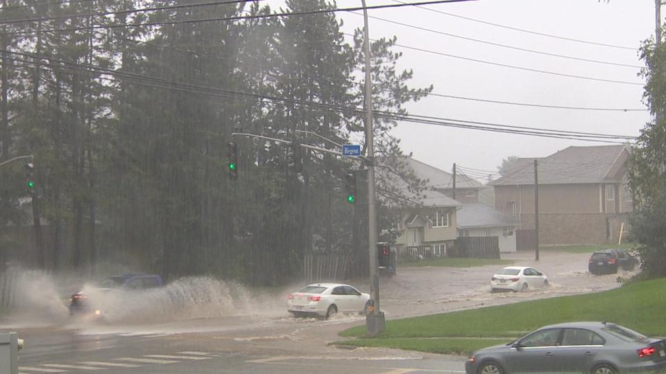 Extensive flooding at the Regent and Montgomery intersections didn't stop vehicles from driving through. 