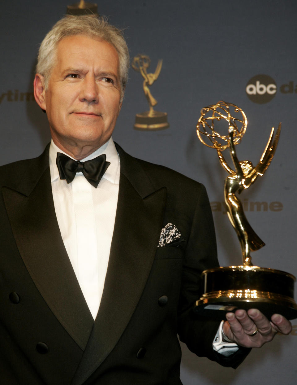 Alex Trebek, host of the game show "Jeopardy" poses with his Emmy award at the 33rd annual Daytime Emmy Awards in Hollywood, California April 28, 2006. Trebek won as outstanding game show host. REUTERS/Fred Prouser