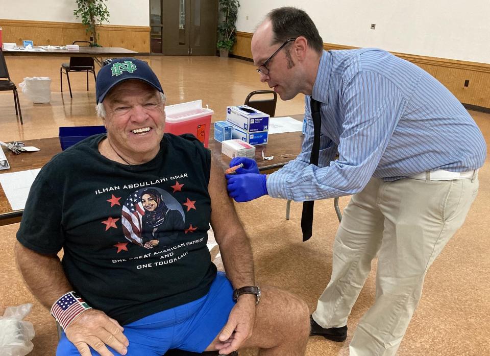 Ed Grande, a 76-year-old Millcreek Township resident, receives a dose of flu vaccine in this September file photo taken at LECOM Health's kickoff vaccination clinic at Zem Zem Shrine, 2525 W. 38th St.