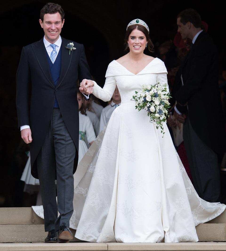 Princess Eugenie of York and Jack Brooksbank leave St George's Chapel in Windsor Castle following their wedding at St. George's Chapel