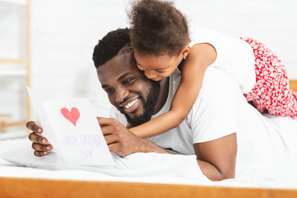 Little girl celebrating Father's Day with daddy