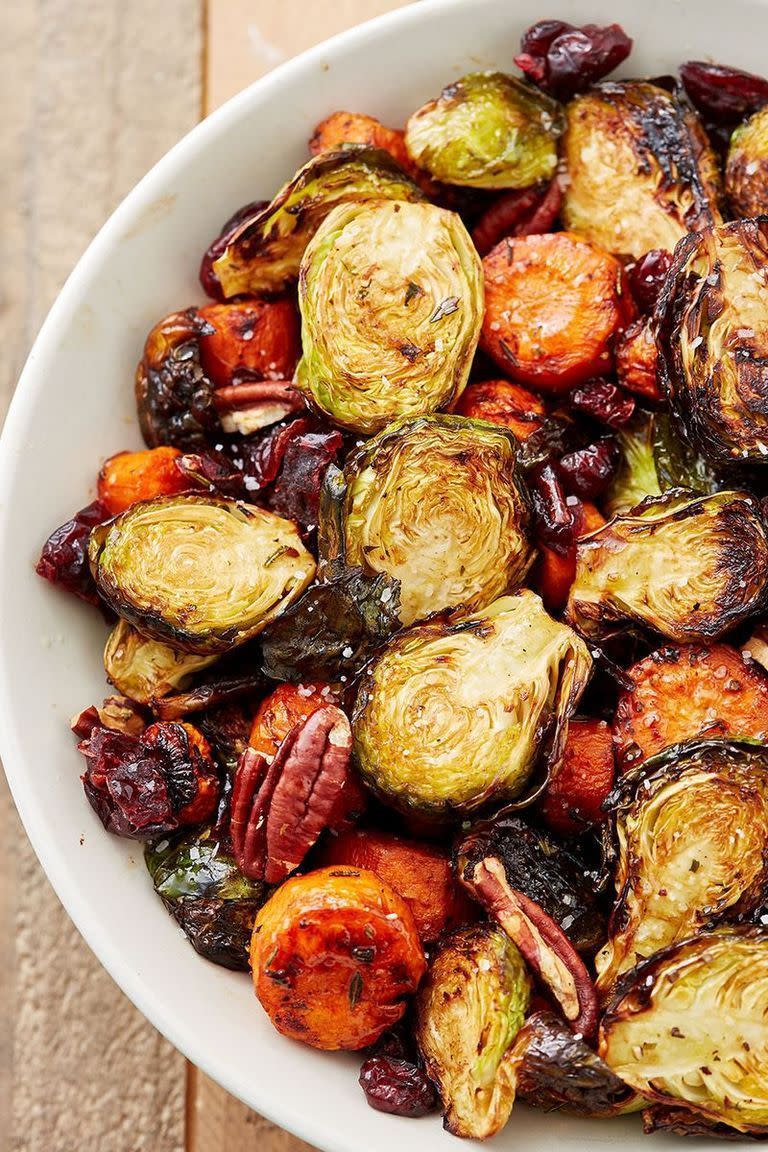 <p>A great addition to your Sunday roast dinner. The dried cranberries add a tartness while the pecans add an extra crunch for a perfect side dish. We use Brussels sprouts and carrots in our medley, but feel free to add extra vegetables or swap in some of your favourites.</p><p>Get the <a href="https://www.delish.com/uk/cooking/recipes/a28934240/holiday-roasted-vegetables-recipe/" rel="nofollow noopener" target="_blank" data-ylk="slk:Roasted Vegetables;elm:context_link;itc:0;sec:content-canvas" class="link ">Roasted Vegetables</a> recipe.</p>