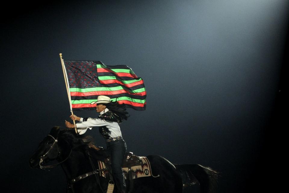 the black american flag during the national western stock show's annual mlk jr rodeo at the denver coliseum on january 16, 2012 aaron ontiveroz, the denver post