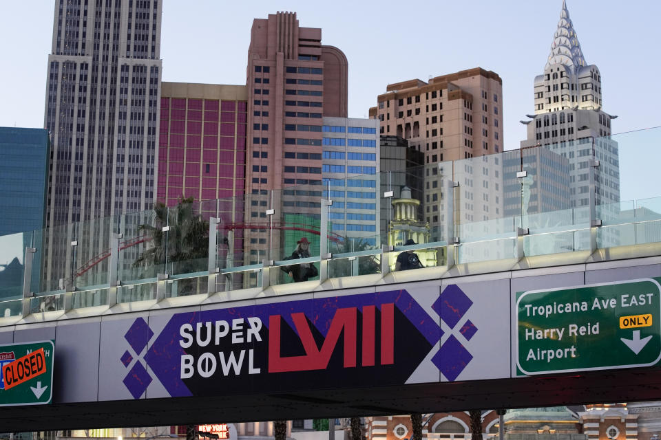 A sign for Super Bowl 58 adorns a pedestrian walkway across the Las Vegas Strip ahead of the Super Bowl, Tuesday, Jan. 30, 2024, in Las Vegas. (AP Photo/John Locher)