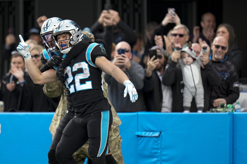 Carolina Panthers running back Christian McCaffrey celebrates after scoring against the Washington Football Team during the second half of an NFL football game Sunday, Nov. 21, 2021, in Charlotte, N.C. (AP Photo/Rusty Jones)