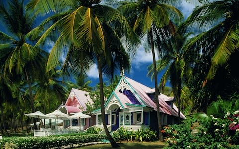 Tours of Mustique provide the opportunity to see the island's distinctive 'gingerbread' houses - Credit: Getty Images