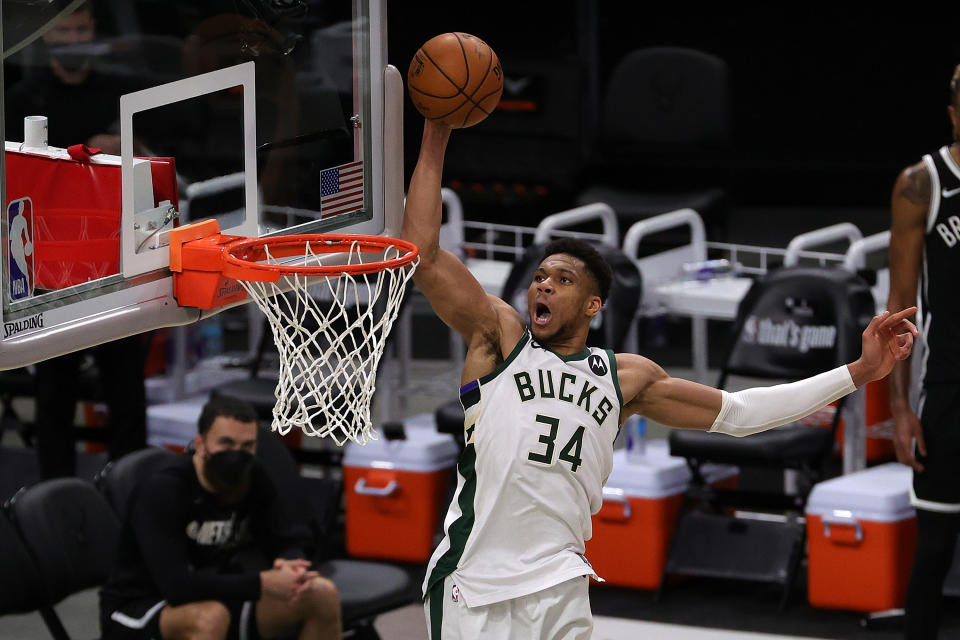 Giannis Antetokounmpo dunks against the Nets during the second half of Game 4 of the Eastern Conference semifinals on June 13, 2021. Milwaukee won to even the series at 2-2. (Stacy Revere/Getty Images)