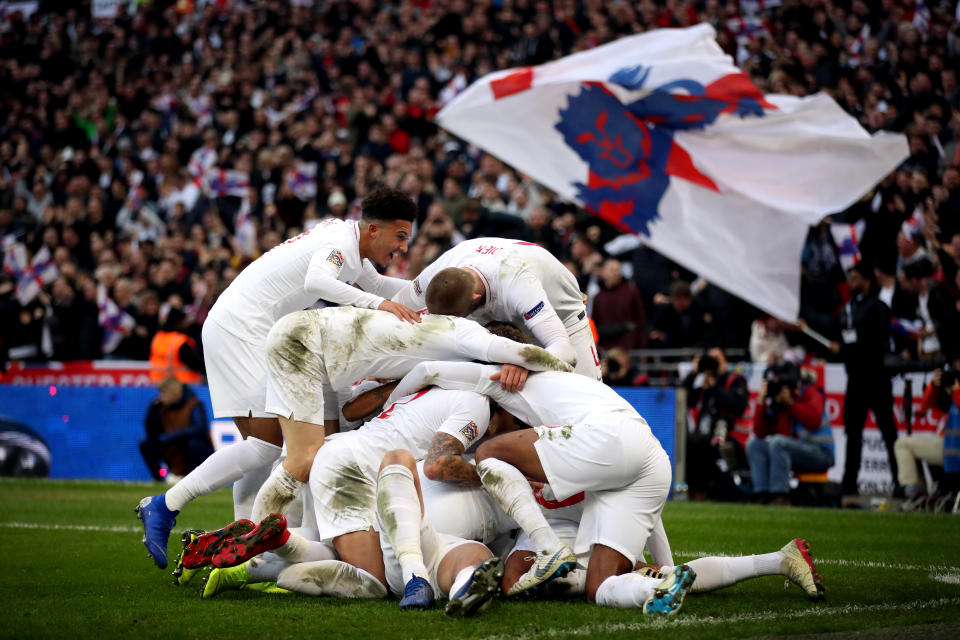 England’s Harry Kane celebrates scoring the winner at a packed Wembley Stadium