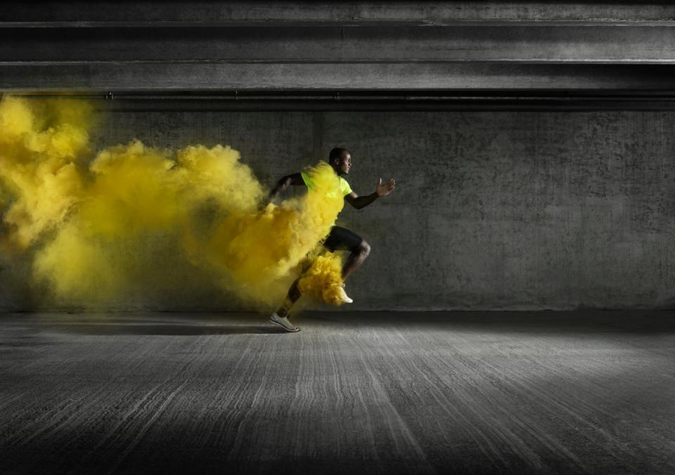 Someone sprints, leaving a trail of yellow smoke dust.