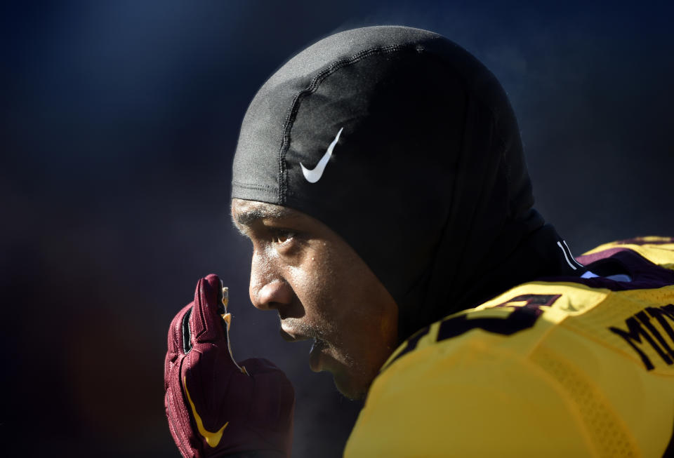 FILE - In this Nov. 21, 2015, file photo, Minnesota's defensive back Ray Buford (25) watches warmups before an NCAA college football game against Illinois, in Minneapolis. Buford is one of ten Minnesota football players suspended this week following a fresh investigation into an alleged sexual assault at an off-campus apartment in September, the father of a player and an attorney for several players said Wednesday, Dec. 14, 2016. Ray Buford Sr., the father of defensive back Ray Buford Jr., said the new suspensions resulted from an investigation by the university’s Office of Equal Opportunity and Affirmative Action that was separate from earlier investigations into the alleged assault in the early hours of Sept. 3. He confirmed that an attorney for his son and other players planned to appeal. (AP Photo/Hannah Foslien, File)