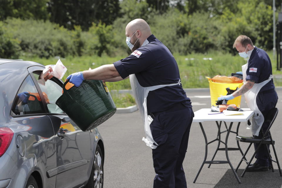 Royal Navy personnel from HMS Prince of Wales operate a mobile testing unit in Eastleigh, Hampshire