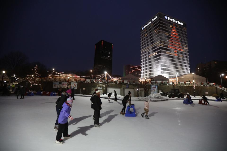 The ice rink was busy with families taking advantage of the free skating at Roc Holiday Village in downtown Rochester, NY on Dec. 16, 2022.  