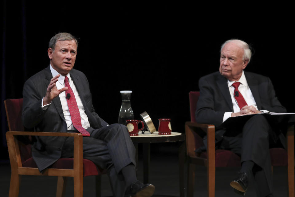 U.S. Supreme Court Chief Justice John Roberts, Jr., left, answers a student's question following his conversation with Professor Robert A. Stein Tuesday, Oct. 16, 2018 at Northrop Auditorium in Minneapolis. (Jeff Wheeler/Star Tribune via AP)