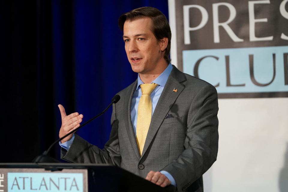 Libertarian candidate Chase Oliver speaks to the media after participating in a debate at the Georgia Public Broadcasting offices in Atlanta, Georgia on October 16, 2022.