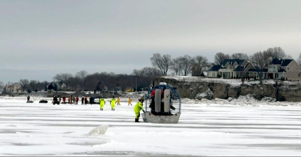 In this image taken from video, U.S. Coast Guard Air Station Detroit and Station Marblehead help ice fishermen stranded on an ice floe near Catawba Island on Lake Erie, Ohio, Monday, Jan. 22, 2024. Twenty people were rescued from an ice floe. (U.S. Coast Guard via AP)