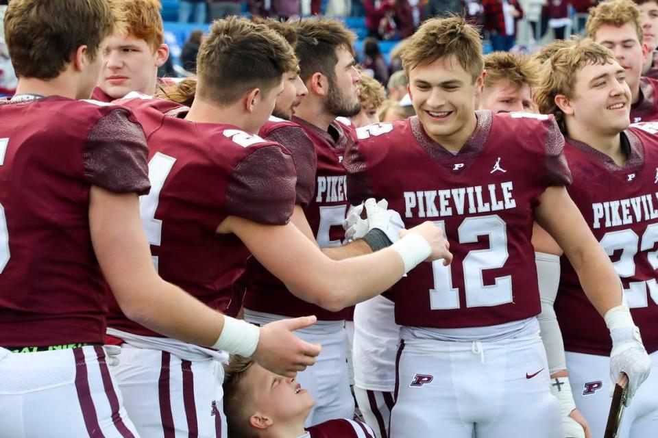 Pikeville’s Blake Birchfield (12) is congratulated by his teammates after being named the MVP of Friday’s Class A state championship game.