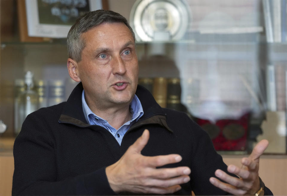 Michael Knape, mayor of the town of Treuenbrietzen, speaks during an interview with the Associated Press about the village of Feldheim in Treuenbrietzen, Germany, Wednesday, Sept. 28, 2022. Located about an hour and a half south of Berlin, the village of Feldheim has been energy self-sufficient for more than a decade. (AP Photo/Michael Sohn)