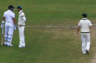 Australia's captain Michael Clarke (C) argues with England's Matt Prior (L) during the fifth day's play in the second Ashes cricket test at the Adelaide Oval December 9, 2013. REUTERS/David Gray (AUSTRALIA - Tags: SPORT CRICKET)