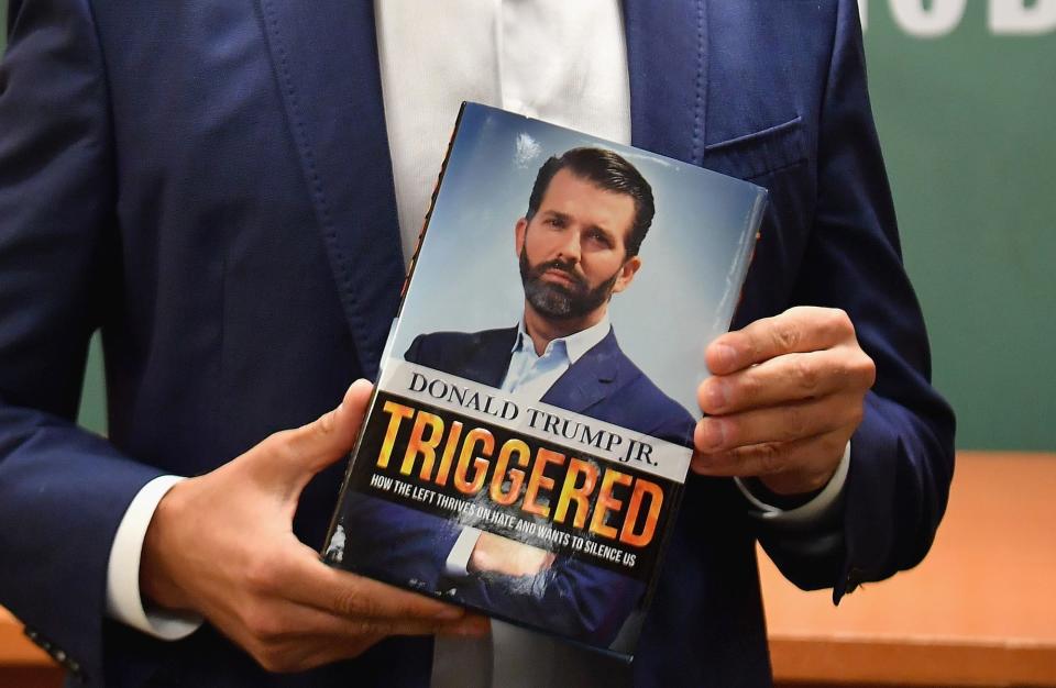 Donald Trump Jr., holds his new Book "Triggered: How the Left Thrives on Hate and Wants to Silence Us" at Barnes & Noble on 5th Avenue on November 5, 2019 in New York.