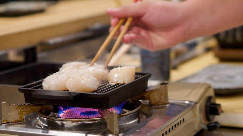 Japanese chef cooking scallops