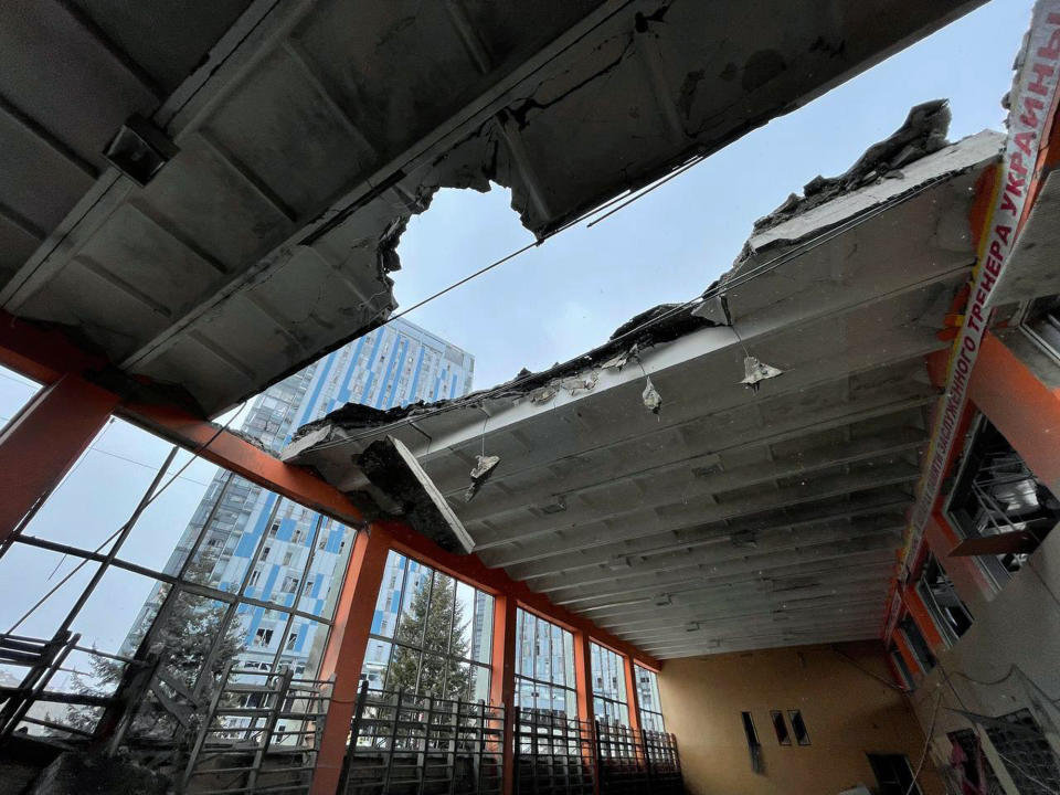 In this photo provided by Yurii Kochubei, a view of the damage after shelling on a sports venue, in Kharkiv, Ukraine, Saturday, March 5, 2022. An official in one of Ukraine's pro-Russia separatist region says Russian forces will observe a temporary cease-fire Sunday in two Ukrainian cities. An agreement to allow civilians to evacuate collapsed a day earlier amid continued shelling and the flight of refugees to neighboring nations. (Yurii Kochubei via AP)