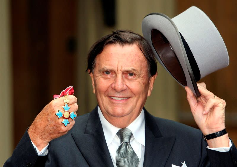 FILE PHOTO: Australia's Barry Humphries poses after receiving his Most Excellent Order of the British Empire from the Queen at Buckingham Palace, London