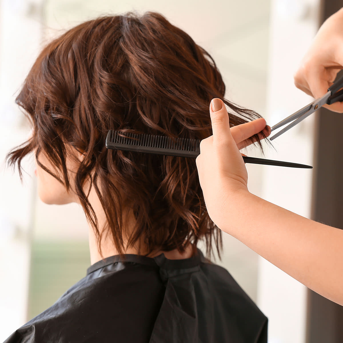 hairdresser-cutting-medium-length-hair