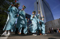 <p>Protesters dressed as the Statue of Liberty march during a demonstration in the center of Brussels on May 24, 2017. Demonstrators marched in Brussels ahead of a visit of US President Donald Trump and a NATO heads of state summit which will take place on Thursday. (Photo: Peter Dejong/AP) </p>