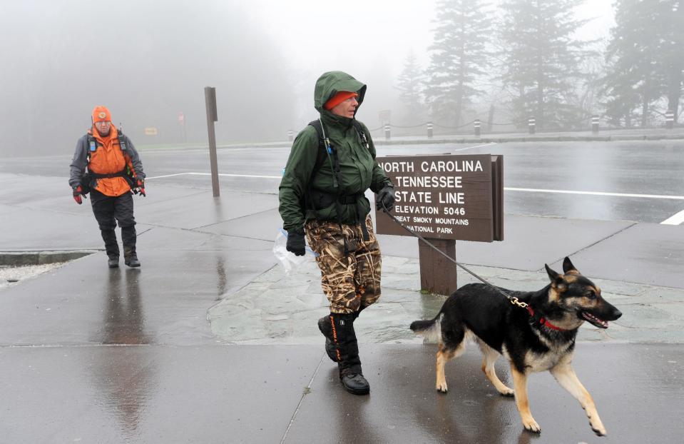 South Carolina Foothills search and rescue's Chris Harrelson, left, and Dave Milan take search dog Fresko out to search Newfound Gap for missing person Derek Lueking.