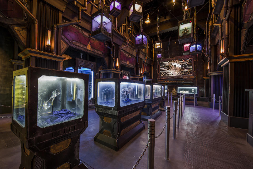 <p>As visitors enter the attraction, they pass through display cases stuffed with surprising items from the Marvel Cinematic Universe. (Photo: Disneyland Resort) </p>