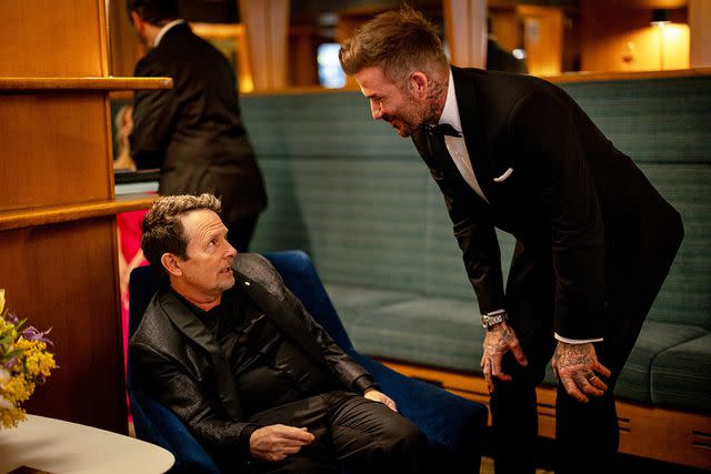 <p>Carlo Paloni/BAFTA/Getty</p> Michael J. Fox and David Beckham