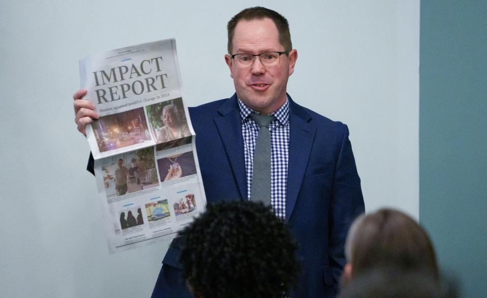 Eric Larsen, recently named the new executive editor of IndyStar, meets with staff Monday, Jan. 22, 2024, inside the IndyStar offices downtown Indianapolis. Here, Larsen holds up and speaks about the impact IndyStar's reporting had on the community.