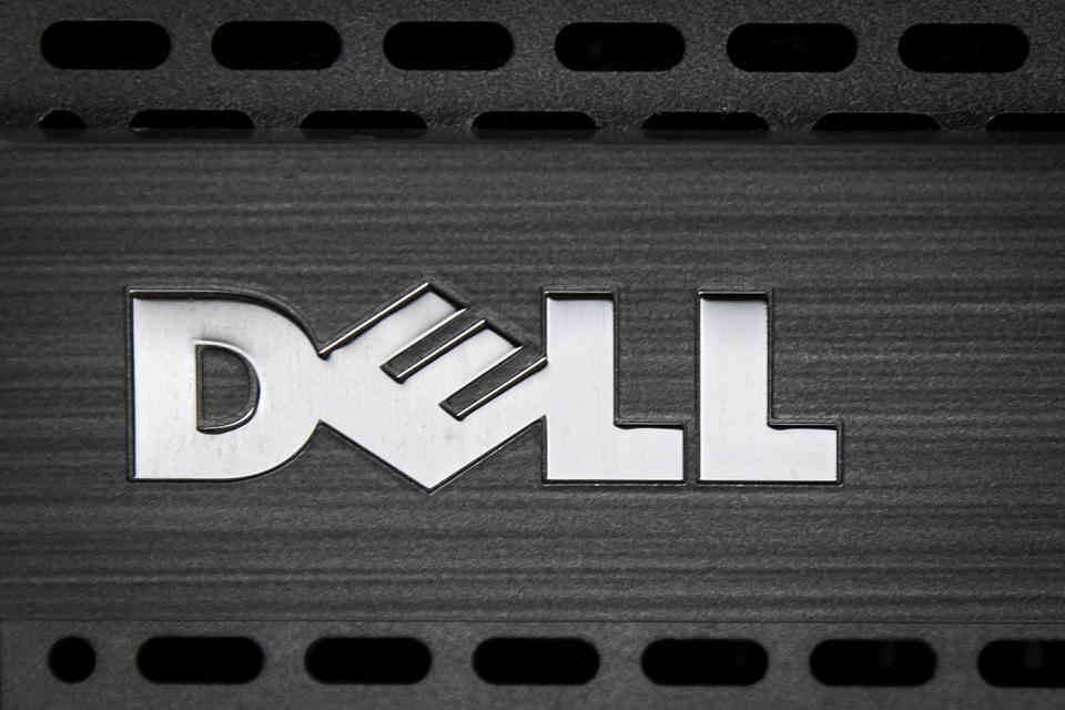 A Dell logo is pictured on the front of a computer in this photo illustration in the Manhattan borough of New York October 12, 2015. Computer maker Dell Inc said on Monday it had agreed to buy data storage company EMC Corp in a $67 billion record technology deal that will unite two mature companies and create an enterprise technology powerhouse.   REUTERS/Carlo Allegri - GF10000242244