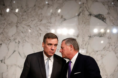 Sen. Mark Warner (D-VA) speaks with Sen. Richard Burr (R-NC) after a hearing of the Senate Intelligence Committee on Capitol Hill in Washington, U.S., February 13, 2018. REUTERS/Aaron P. Bernstein??