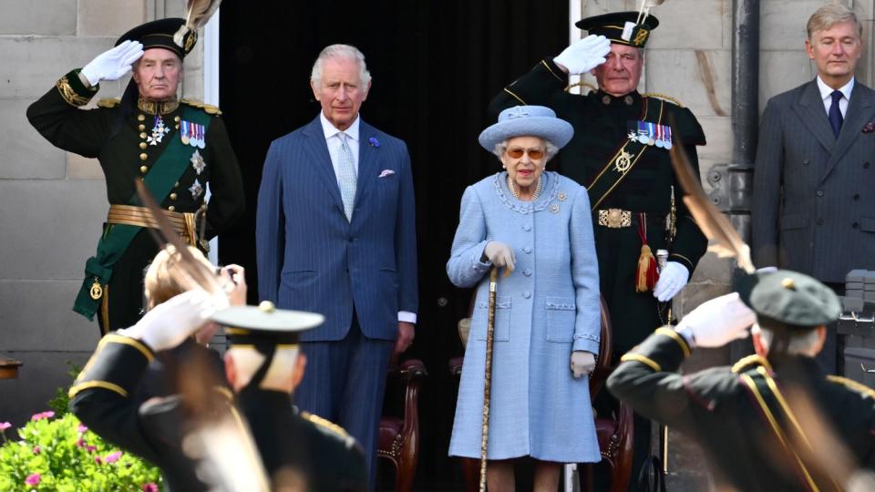 Prince Charles, Prince of Wales and Queen Elizabeth II attend the Royal Company of Archers Reddendo Parade in the gardens of the Palace of Holyroodhouse