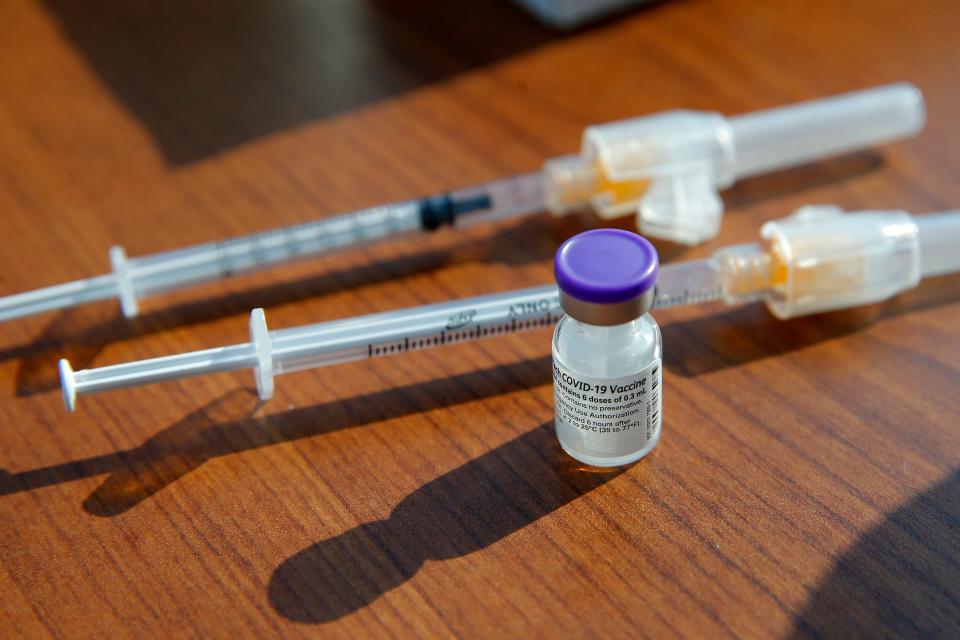 A vial containing a COVID-19 vaccine is pictured July 23, 2021, at the Mercy COVID-19 vaccine clinic inside the Meinders Neuroscience Institute in Oklahoma City.