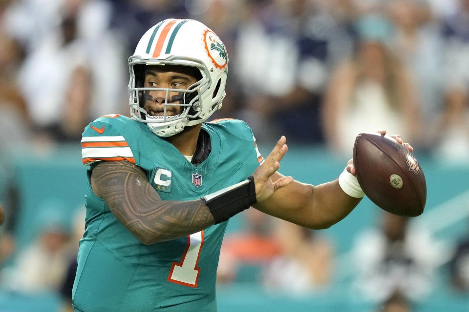 Miami Dolphins quarterback Tua Tagovailoa (1) looks to pass during the first half of an NFL football game against the Dallas Cowboys, Sunday, Dec. 24, 2023, in Miami Gardens, Fla. (AP Photo/Rebecca Blackwell )