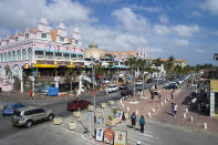 <h2><b>1. Aruba</b><br>Highest income tax rate: 58.95%<br>Average 2010 income: N/A</h2><br><br>Aruba, a Dutch territory, has the highest income tax rate in the world. It is also the only country in the Americas to make the top 10 list.<br><br>The tax rate used to be as high as 60 percent before 2007. The current top marginal rate of 59 percent kicks in at around $165,000. Married individuals have a lower maximum rate of 55.85 percent, compared with single taxpayers at 58.95 percent. Other notable taxes include a capital gains tax of 25 percent, along with health, pension and accident insurance premiums. With an array of social security taxes, Aruba is known to have one of the highest living standards in the Caribbean.<br><br>The small island’s exceptionally high tax rate is also much higher than the Caribbean average of 26.7 percent. Islands like the Bahamas, Bermuda and Cayman Islands have no personal income taxes. The closest to Aruba in terms of income tax rates are neighboring South American countries Argentina, Colombia, Ecuador, Guatemala and Venezuela, which have maximum tax rates ranging between 31 percent and 40 percent, according to KPMG.<br><br>Pictured: Oranjestad, Aruba --<span> Best Countries For Long-Term Growth </span>