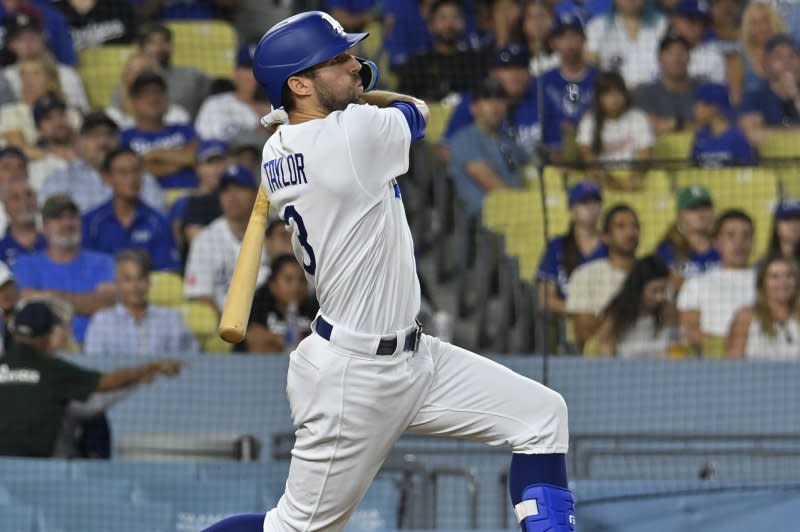 Los Angeles Dodgers left fielder Chris Taylor hits a solo home run against the Milwaukee Brewers on Wednesday at Dodgers Stadium in Los Angeles. Photo by Jim Ruymen/UPI