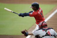 Atlanta Braves' Ozzie Albies swings for a double against the St. Louis Cardinals during the first inning of a baseball game Friday, June 18, 2021, in Atlanta. (AP Photo/Ben Margot)