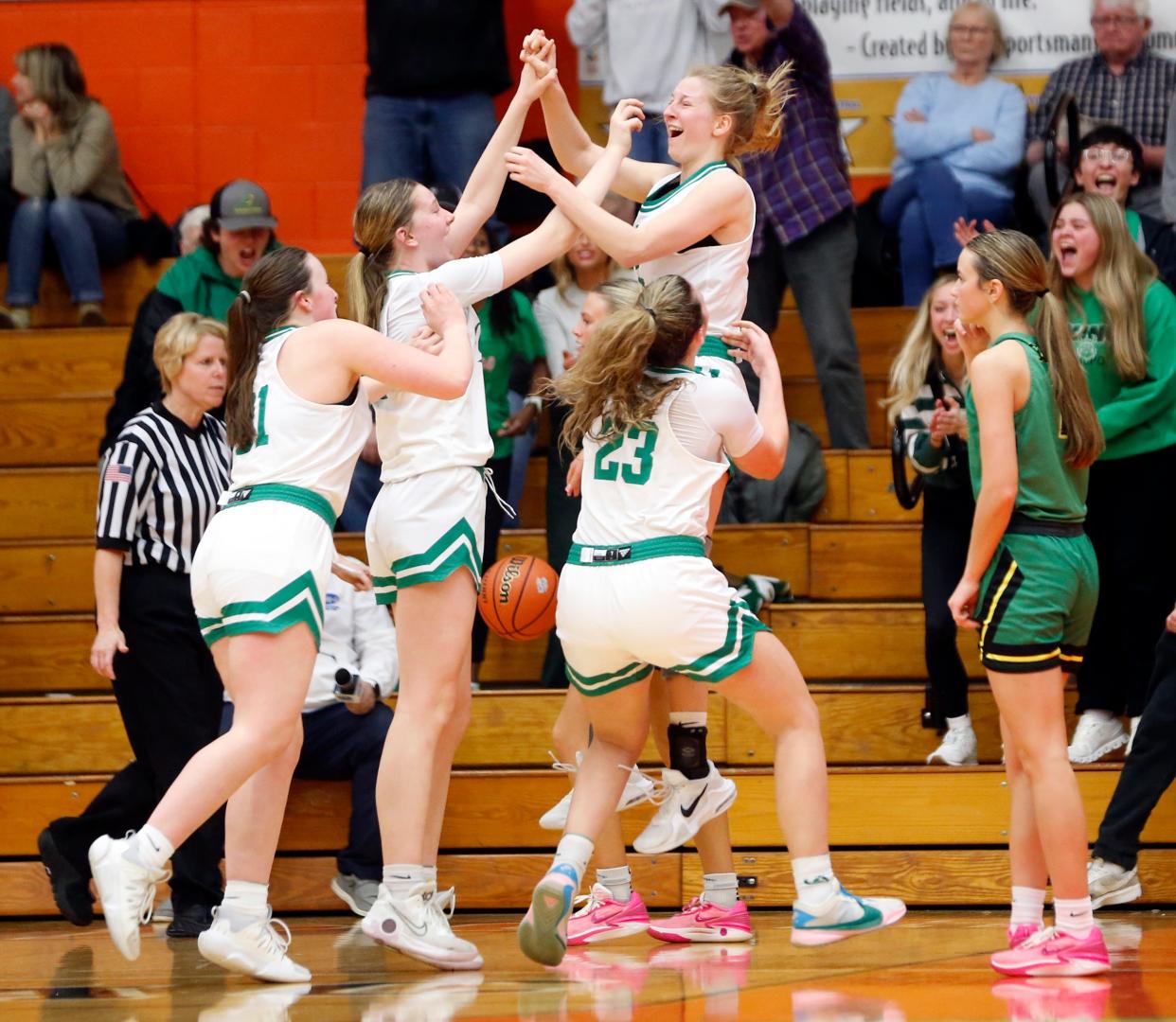 Valparaiso players celebrate after senior Rebecca Gerdt made a layup with 8.2 seconds left, giving the Vikings the lead in a Class 4A girls basketball regional championship game against Northridge Saturday, Feb. 10, 2024, at LaPorte High School.
