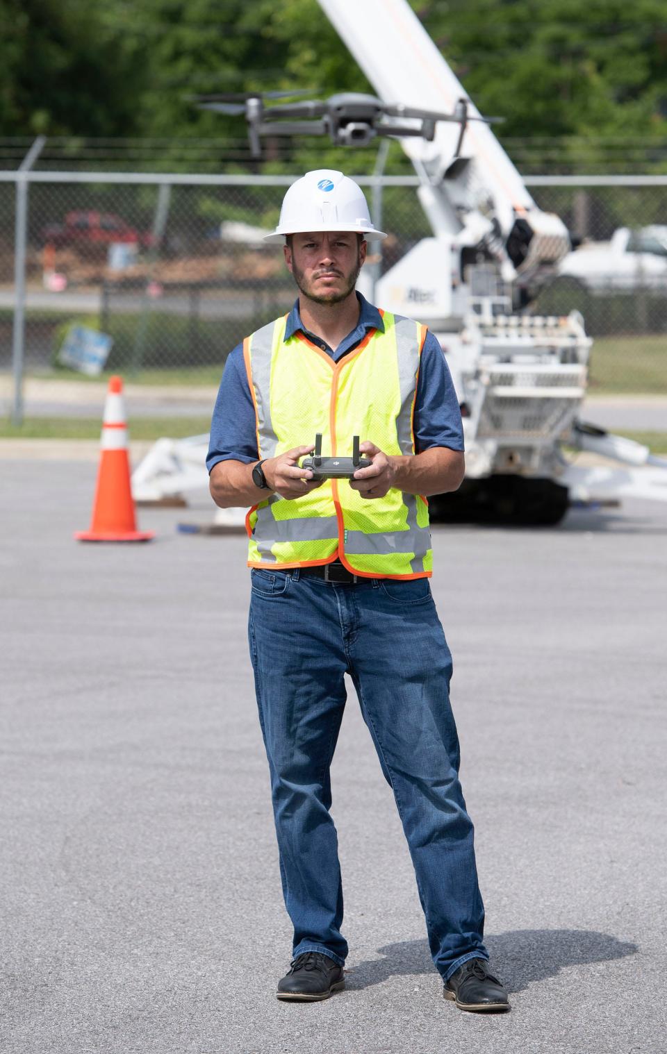 Florida Power & Light employee Mark Telhiard demonstrates the flight characteristics of one of the company's drones on Thursday.