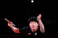 <p>TOKYO, JAPAN - AUGUST 04: Jang Woo-jin of Team South Korea serves as he competes against China's Fan Zhendong during their men's team semifinal table tennis match on day twelve of the Tokyo 2020 Olympic Games at Tokyo Metropolitan Gymnasium on August 04, 2021 in Tokyo, Japan. (Photo by Naomi Baker/Getty Images)</p> 