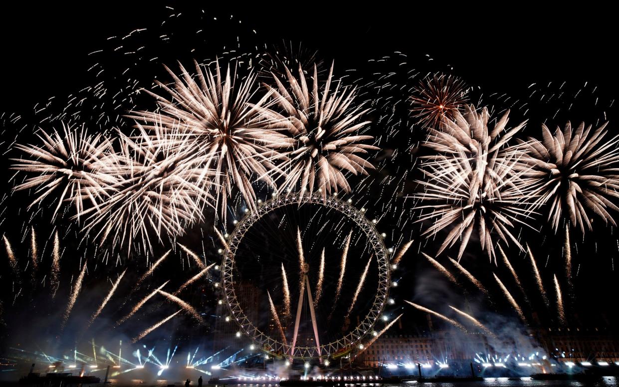 Fireworks light-up the sky over the London Eye in central London