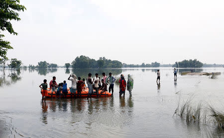 People are rescued from a flooded village in Motihari, Bihar State, India August 23, 2017. REUTERS/Cathal McNaughton