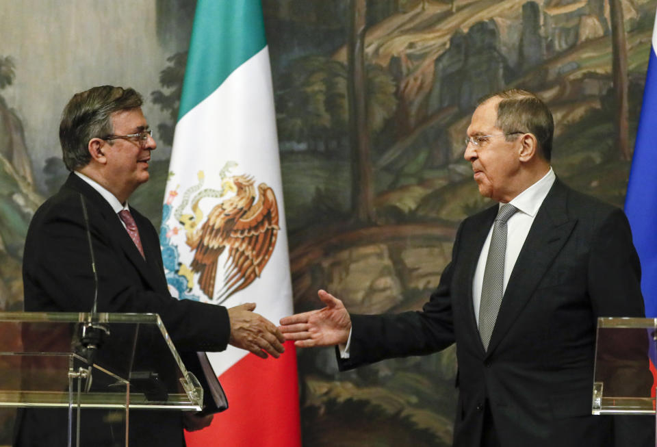 Russian Foreign Minister Sergey Lavrov, right, and Mexican Foreign Minister Marcelo Ebrard shake hands at the press conference after their meeting in Moscow, Russia, Wednesday, April 28, 2021. Mexican Foreign Minister Marcelo Ebrard is on a working visit to Moscow. (Yuri Kochetkov/Pool Photo via AP)