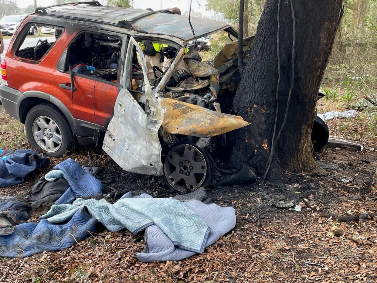 FHP troopers said the driver behind the wheel of this older model Ford Escape died when it slammed into a tree and burst into flames. The driver has not been identified.