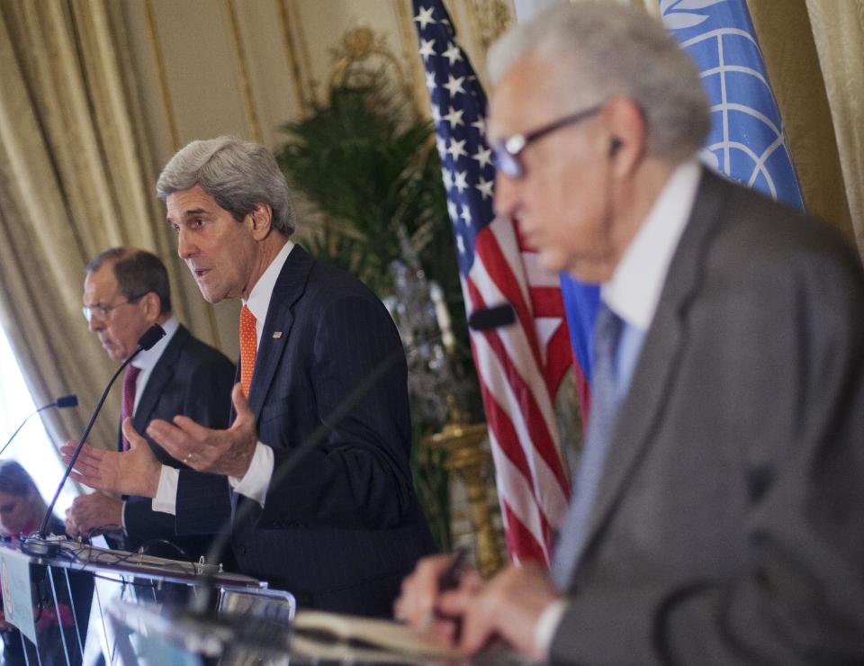 US Secretary of State John Kerry, center, with Russia's Foreign Minister Sergey Lavrov, left, and U.N-Arab League envoy for Syria Lakhdar Brahimi, right, during a joint news at the US Ambassador's residence in Paris, France, Monday, Jan. 13, 2014. Kerry is in Paris for meetings on Syria to rally international support for ending the three-year civil war in Syria. (AP Photo/Pablo Martinez Monsivais, Pool)