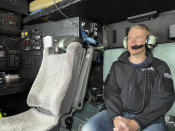 New Zealand's Prime Minister Chris Hipkins sit in a military plane Saturday, Jan. 28, 2023 bound for Auckland to assess the rain and flooding damage. Torrential rain and flooding continued to cause widespread disruption to New Zealand's largest city. (Ryan Benton/Pool Photo via AP)