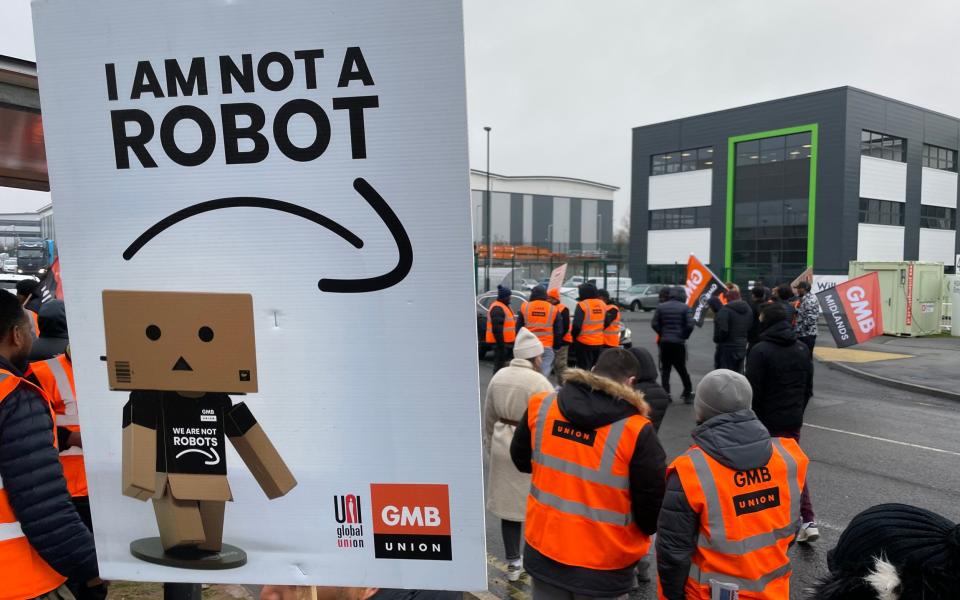 Members of the GMB union on the picket line outside the Amazon fulfilment centre in Coventry - Phil Barnett/PA Wire